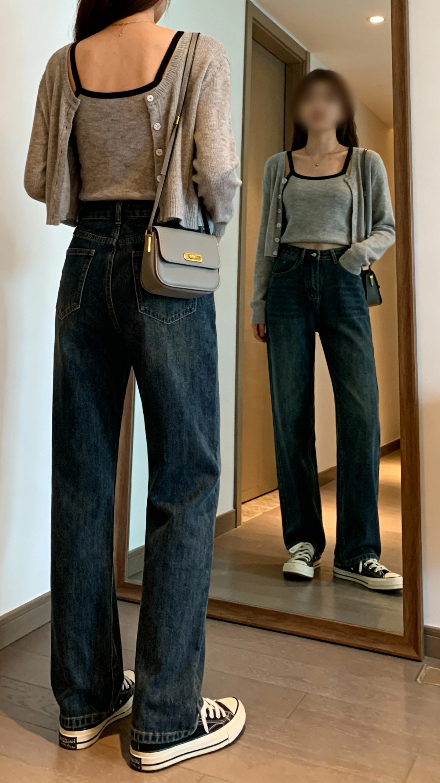 iPhone back view of a woman wearing a cardigan set (tank and matching cardigan) with straight-leg jeans, retro sneakers, and a mini shoulder bag, face not visible, hallway mirror, indoor ambient light, iPhone photo quality.