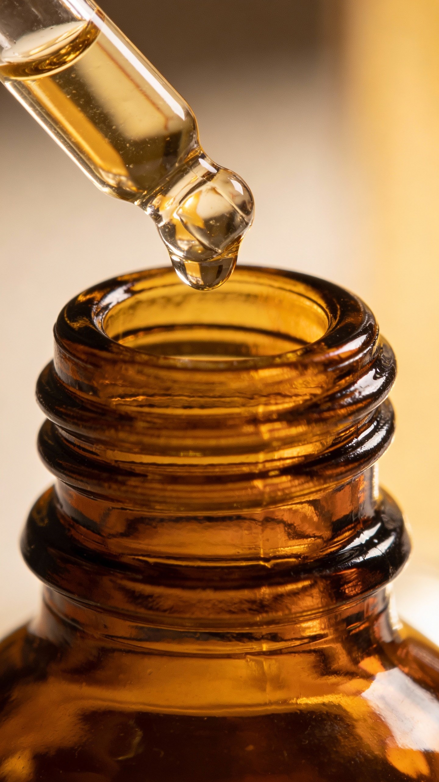 single amber retinol serum bottle with dropper, macro