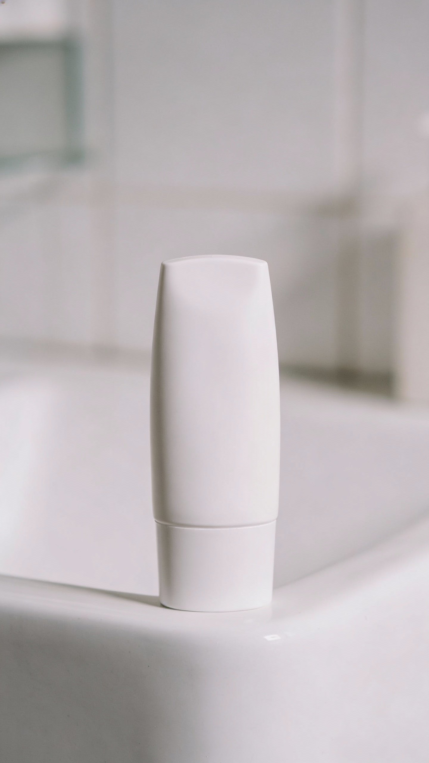 single SPF moisturizer tube on clean white counter