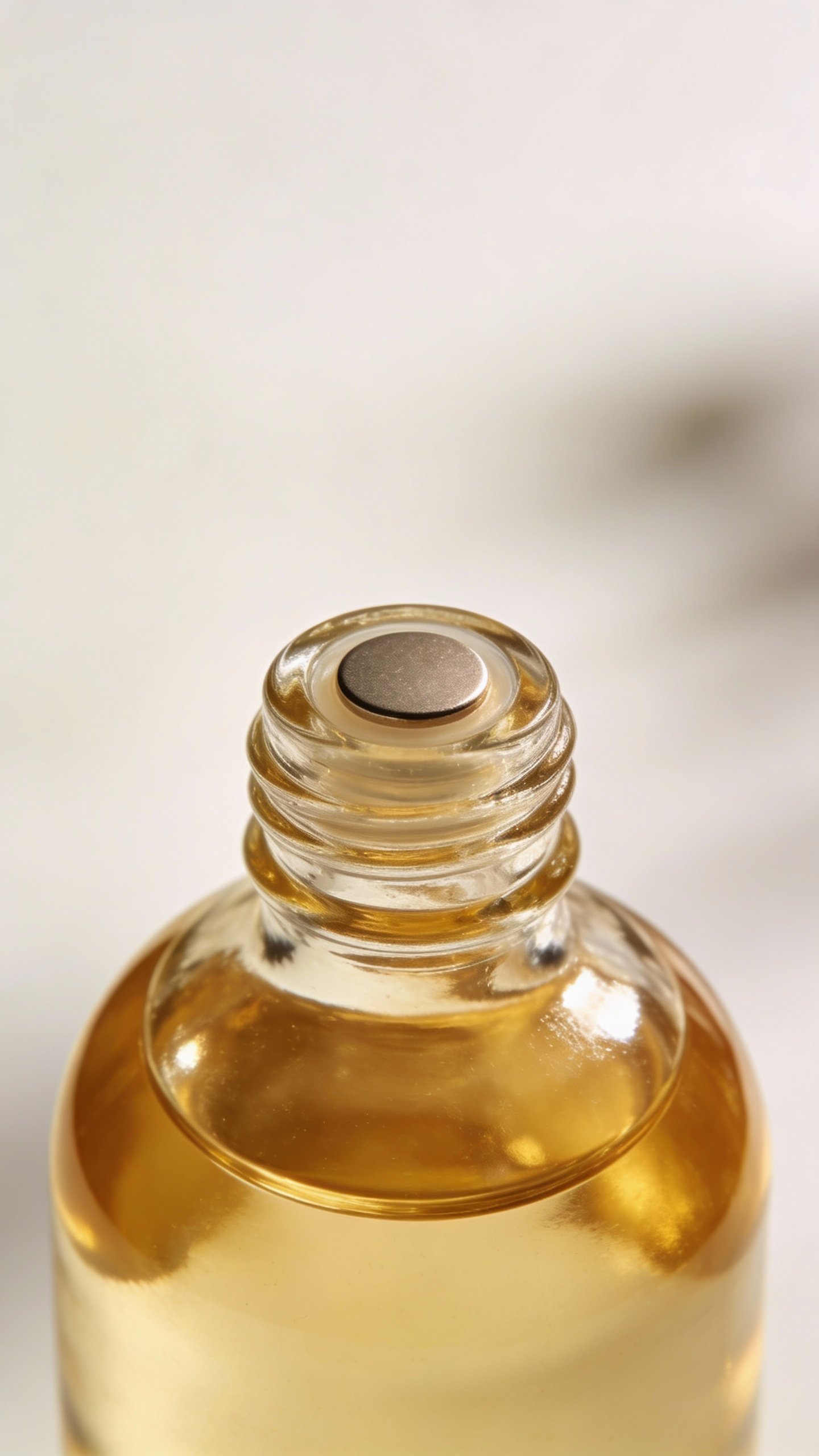 closeup of jojoba oil bottle with minimalist label