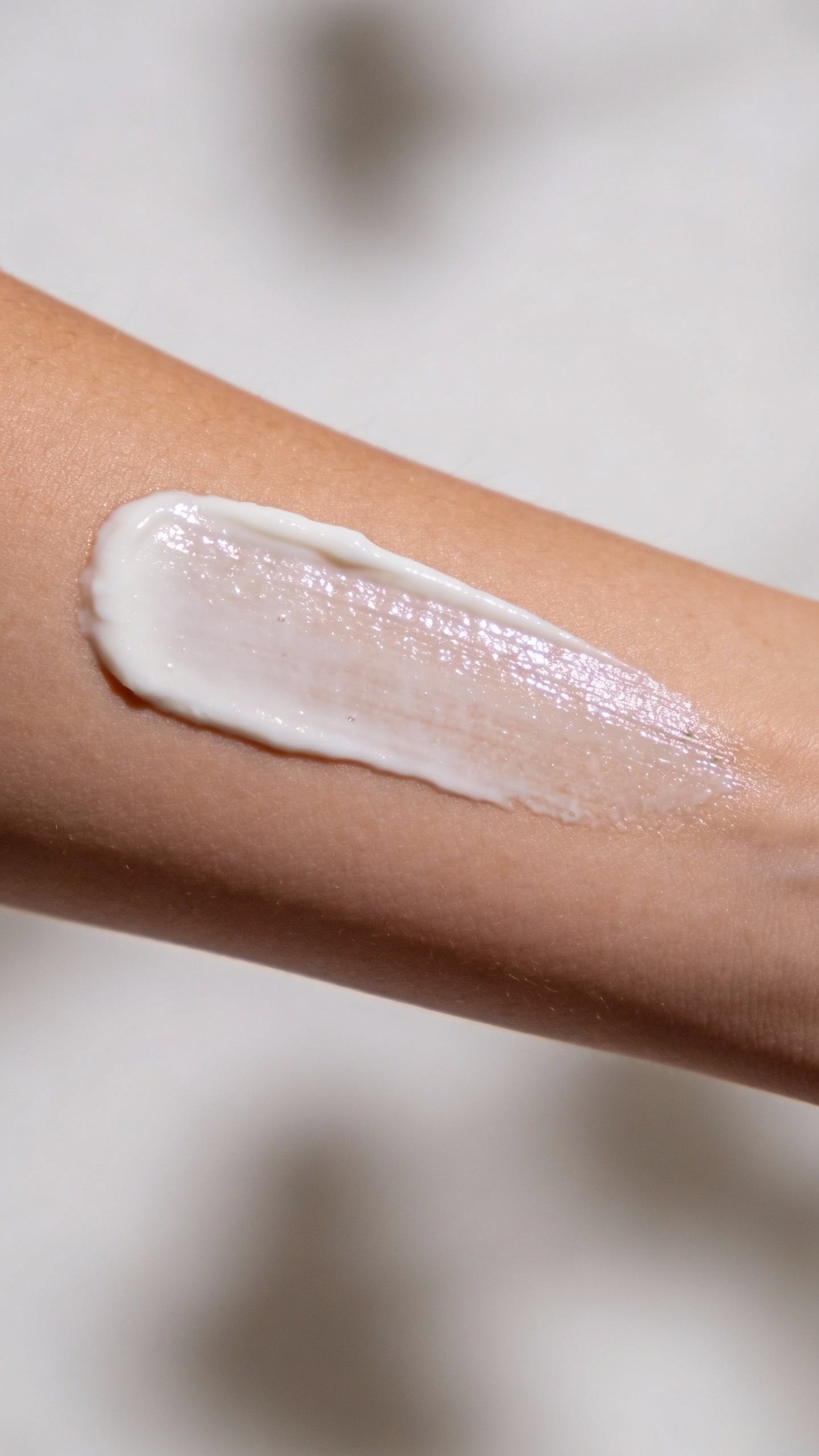 closeup of broad-spectrum SPF smear on forearm, even texture