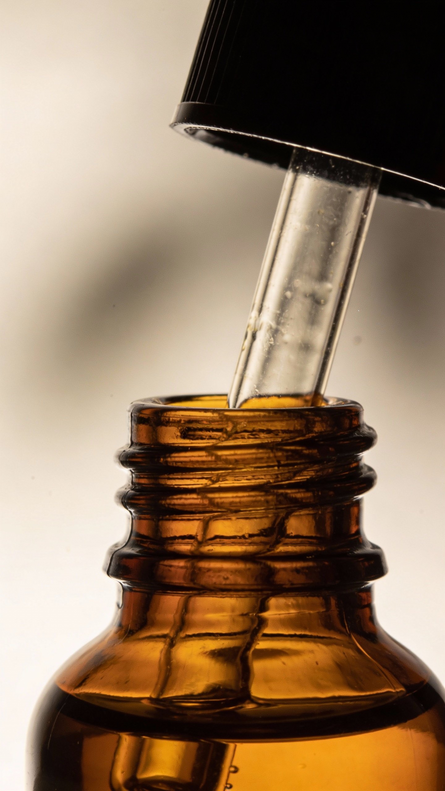 Closeup of amber dropper bottle labeled “DIY Niacinamide Serum”