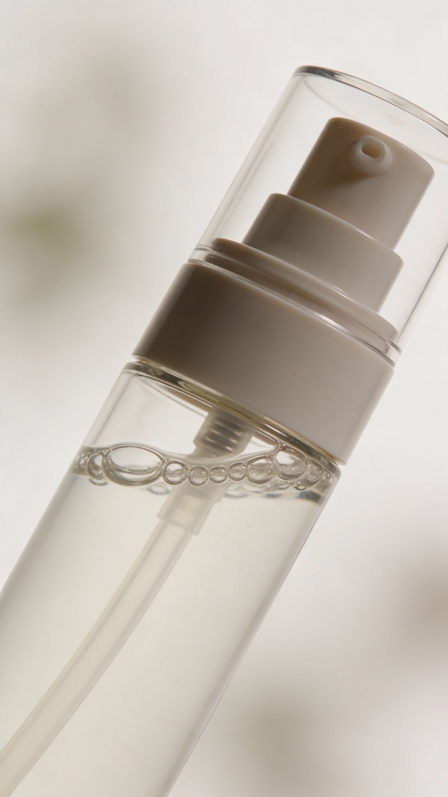 compact refillable airless pump with clear hydrating serum