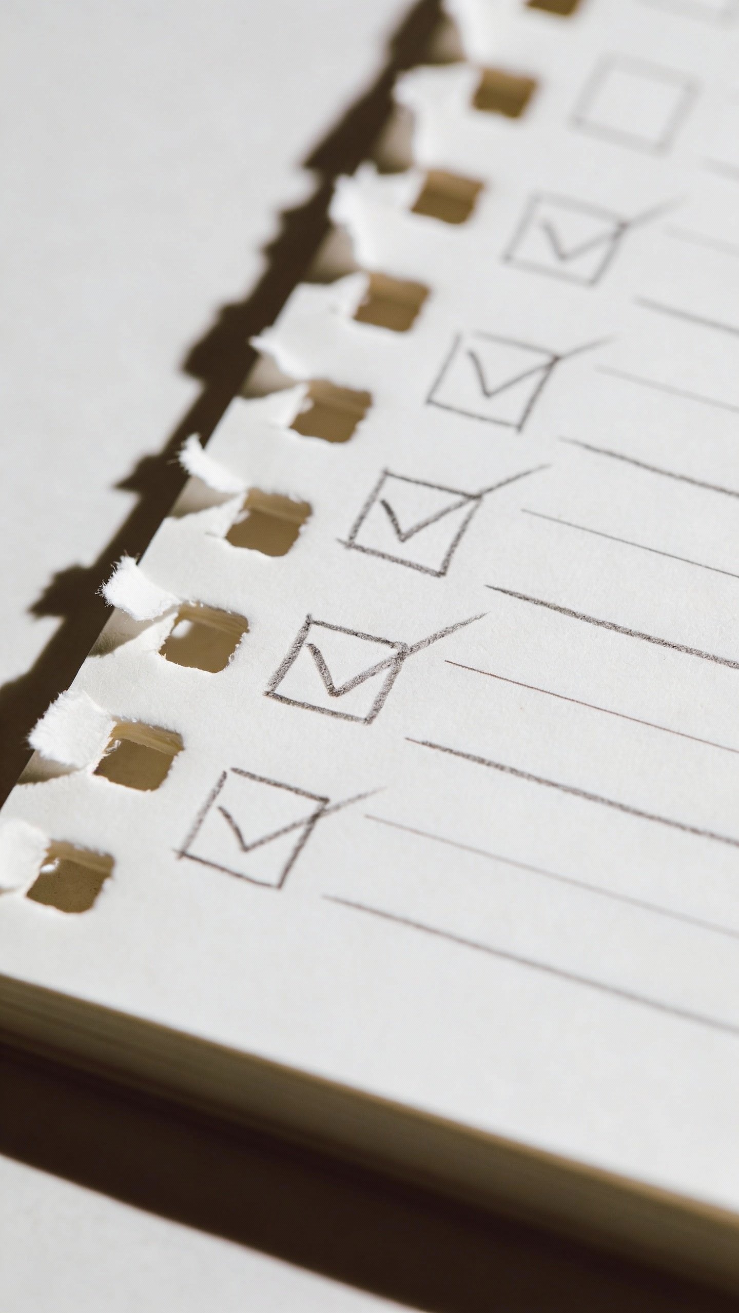 closeup of handwritten style checklist on white index card