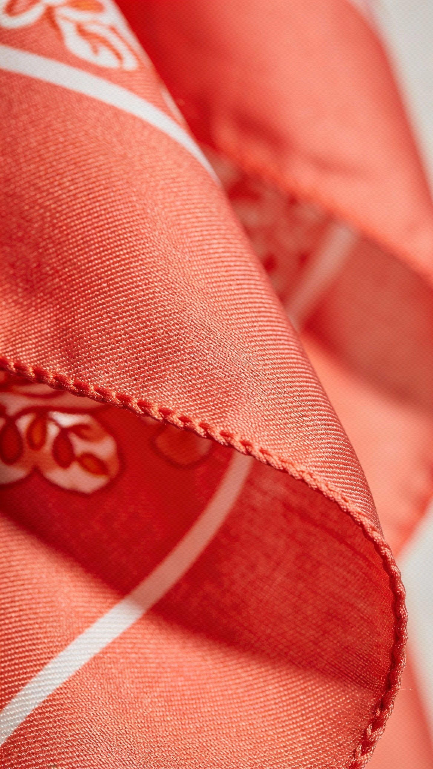 bold coral silk scarf, tight shot of textured weave
