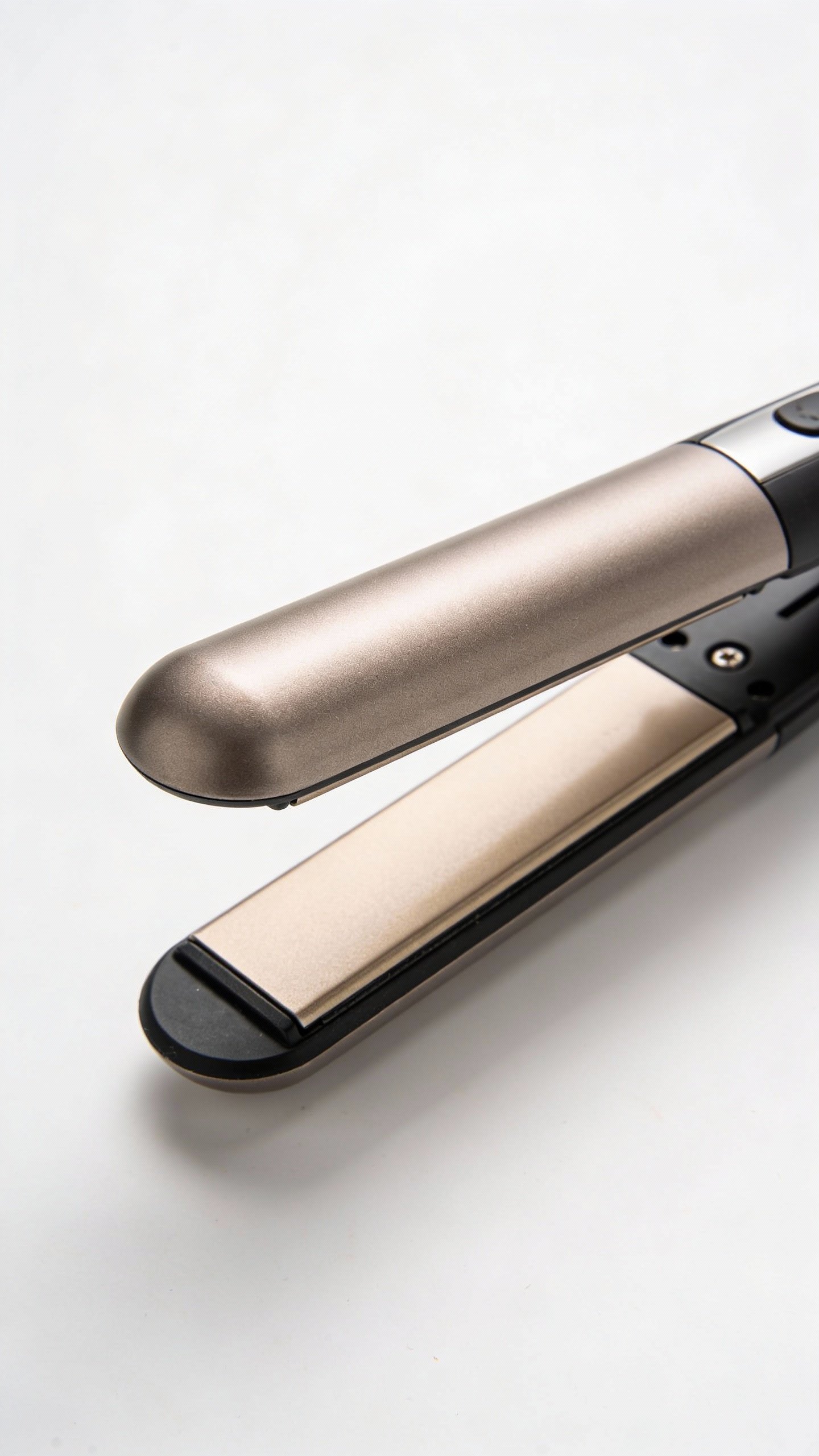 closeup flat iron with rounded plates on white background